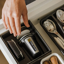 rolling knife sharpener and accessories being pulled from utensil drawer